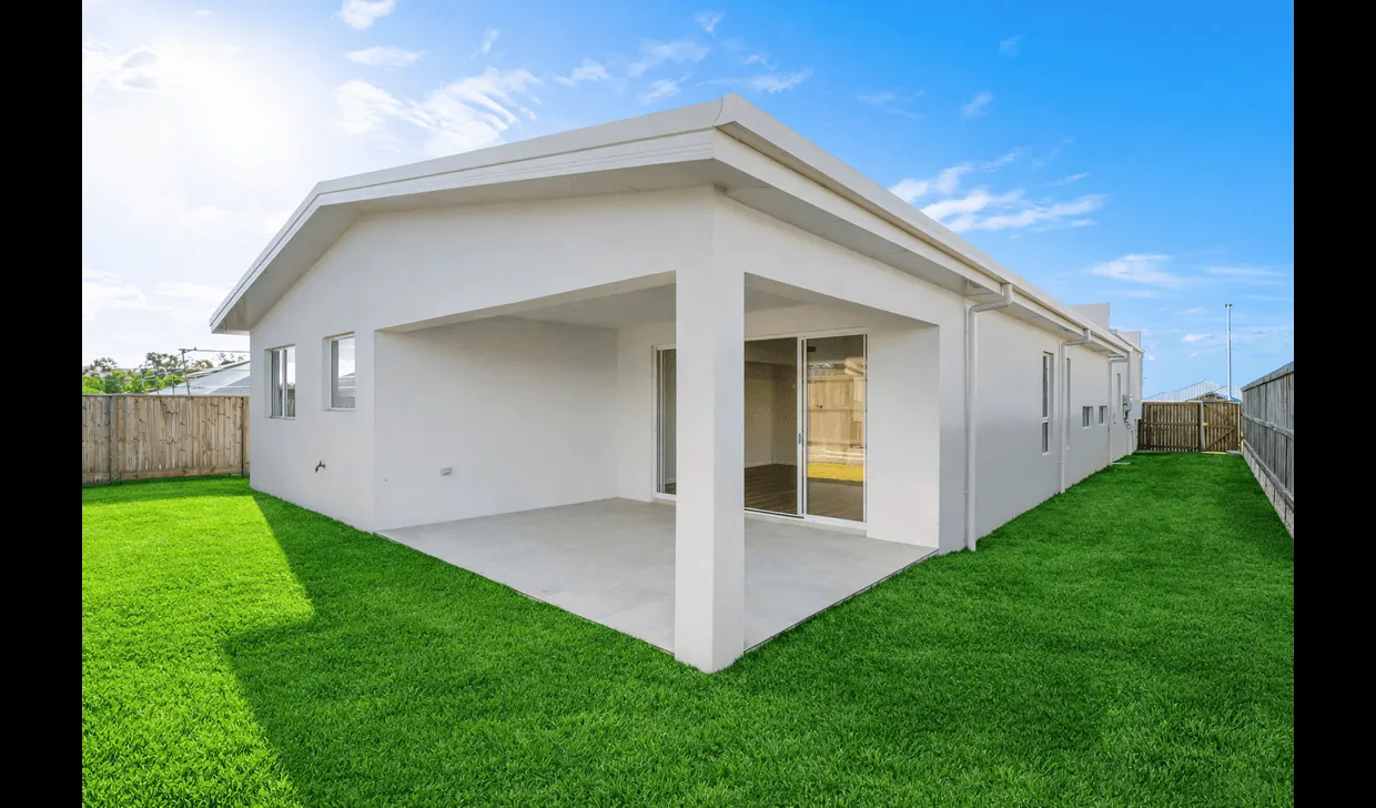 Covered alfresco terrace opening onto the landscaped rear lawn