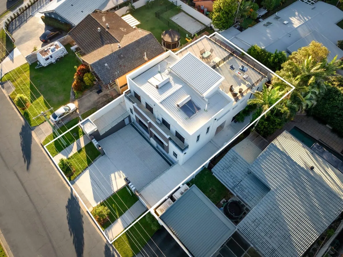 Overhead aerial of the duplex showing site boundary, driveways and rooftop terrace